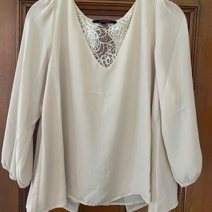 Flowy beige top with lacy exposed back and v-neck. Great for work!